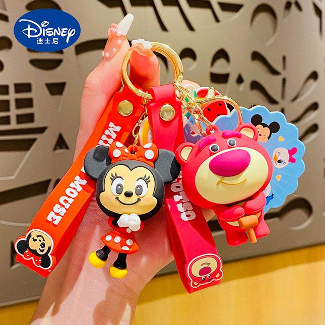 Set of Disney character keychains featuring Mickey, Minnie, Donald, Daisy, and Goofy.