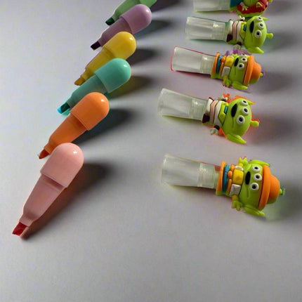 Side view of three-eyed alien highlighters – fun kids’ stationery set